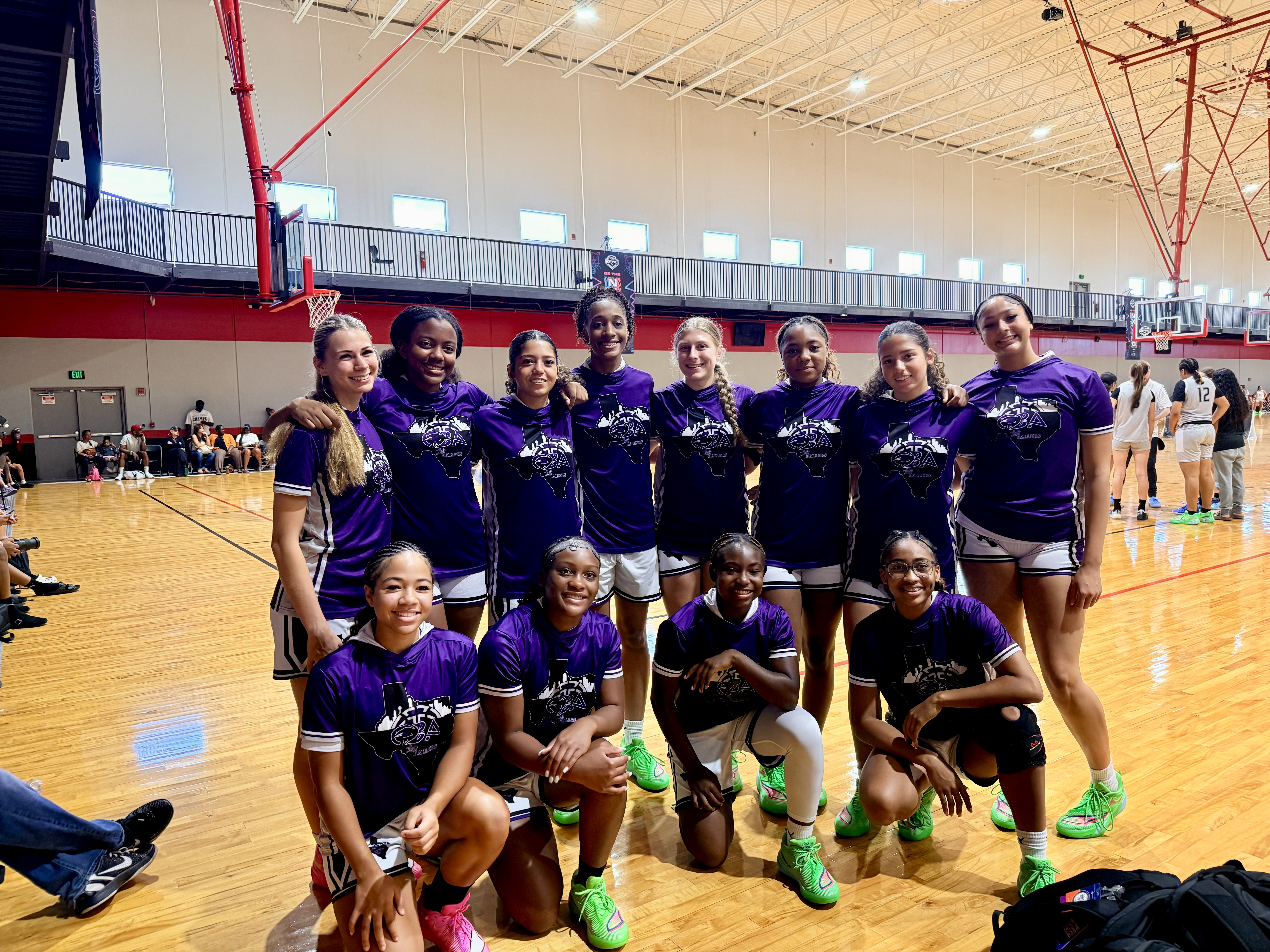 Ballers Ignited athletes and coaches smiling together after a basketball event