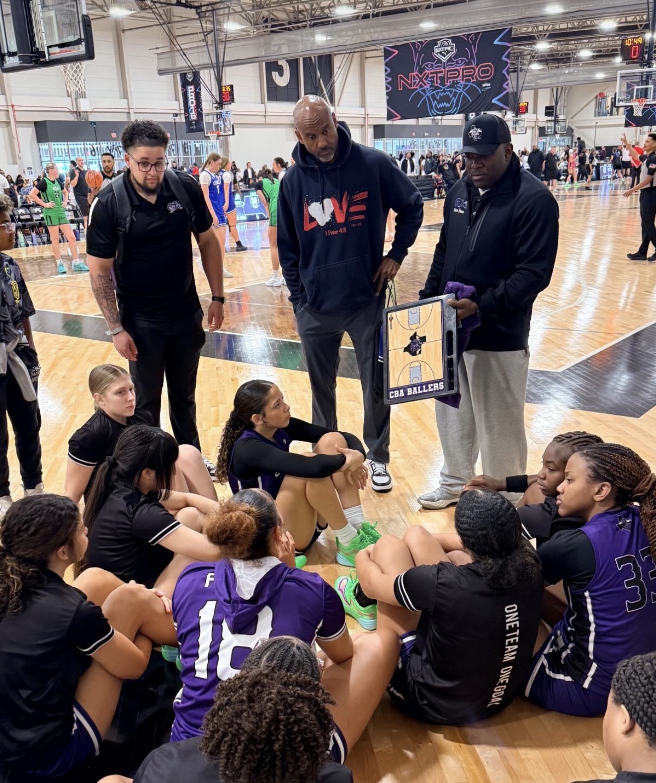 Ballers Ignited athletes and coaches smiling after a basketball event