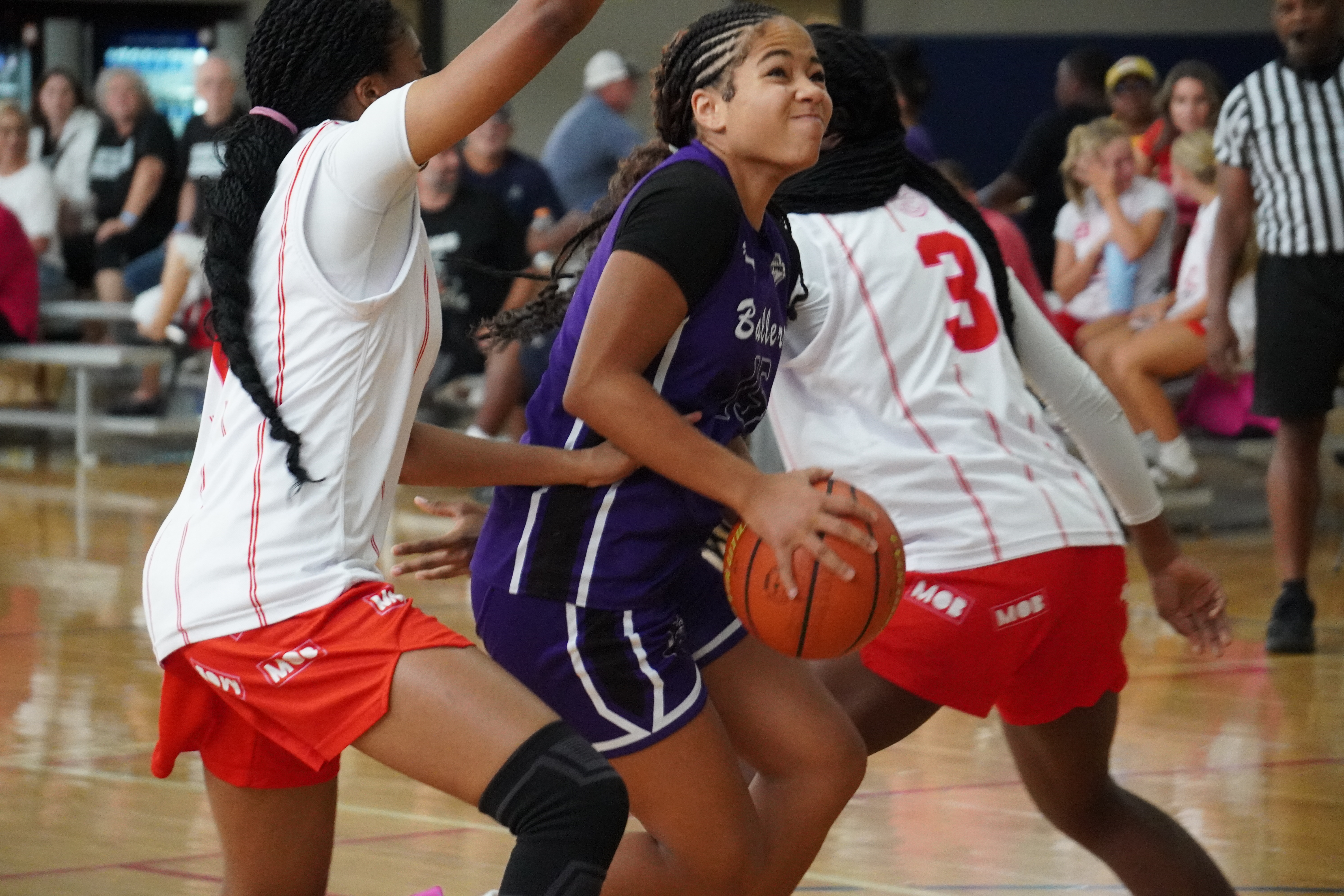 Ballers Ignited athlete attacking off the dribble during a game