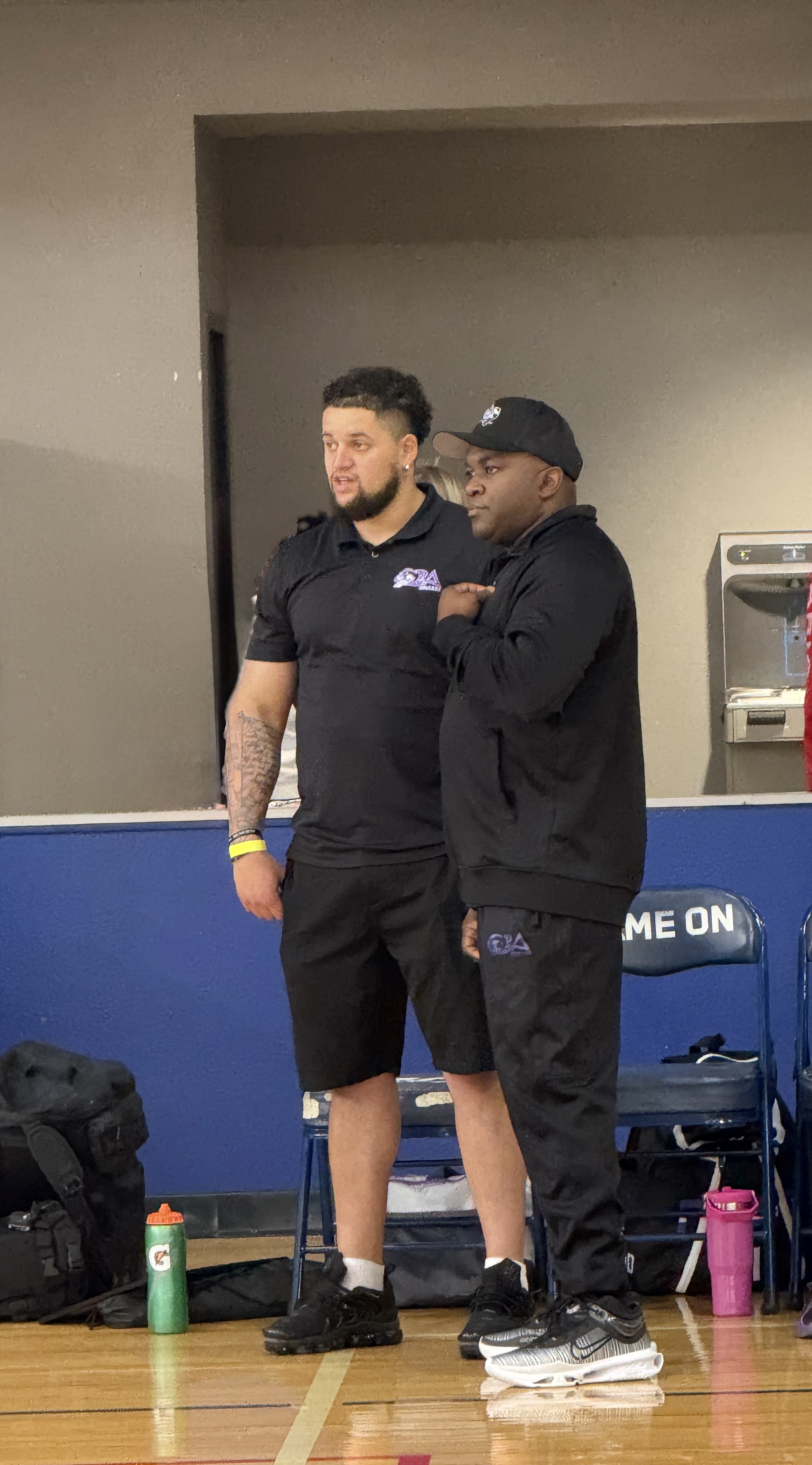 COACHES CONVERSATING BEFORE A GAME
